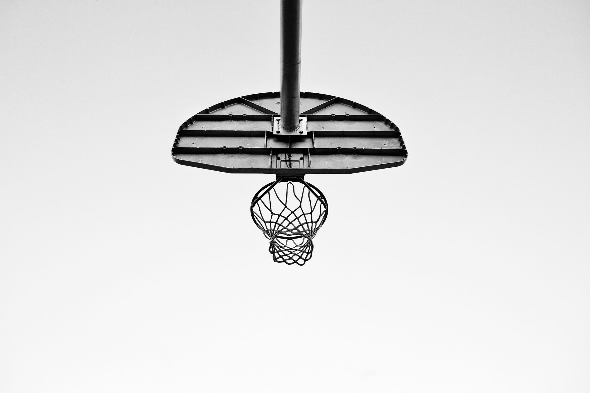 Black Metal basketball hoop. By MontyLov (https://unsplash.com/@montylov) on Unsplash.